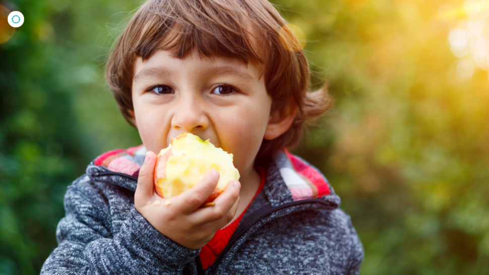 Child eating apple.